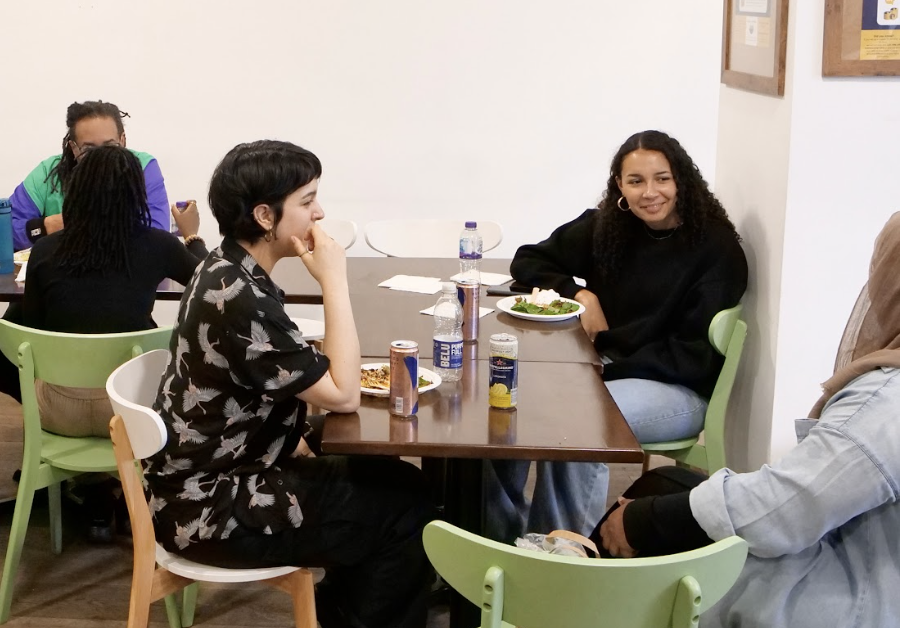 Photo of Shakers smiling and chatting during lunch